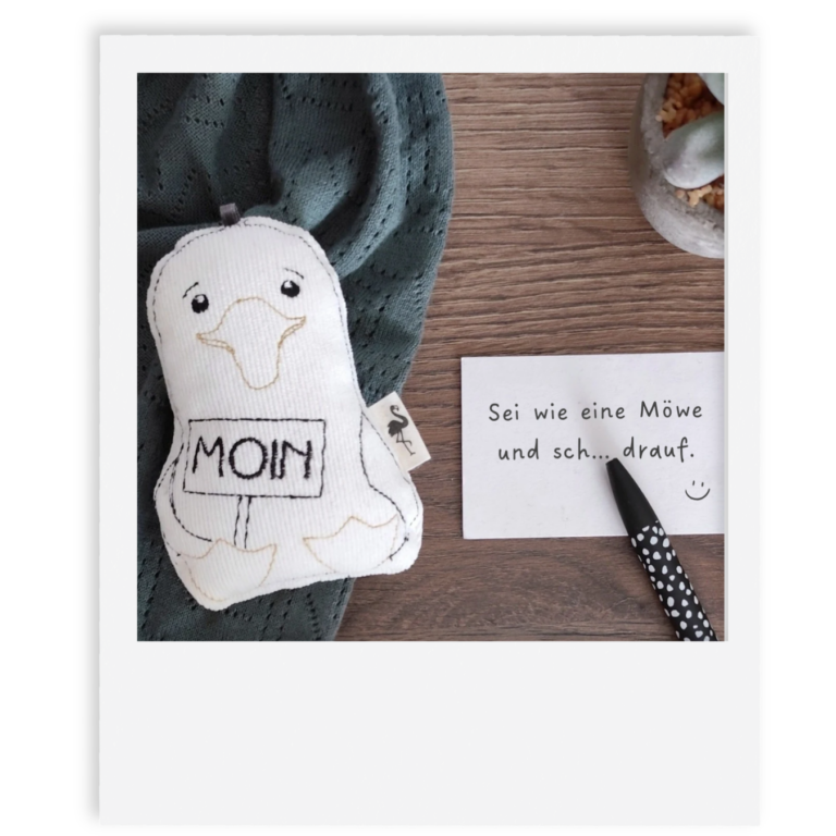 Bild Mutmach Möwe mit Zettel: Sei wie eine Möwe und scheiß drauf.